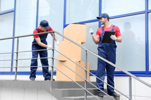 Professional movers handling boxes and furniture in Kingston upon Thames