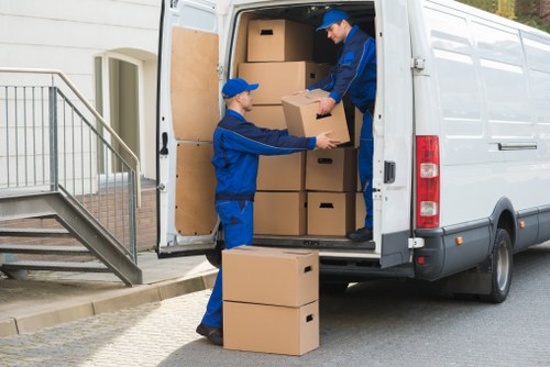 Moving team preparing furniture with safety equipment during a Kingston upon Thames van removal