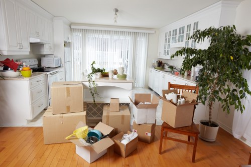 Furniture pick-up service removing a sofa in Kingston upon Thames