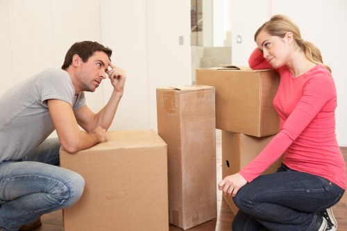 Loading furniture into a moving truck for an office move in Kingstonuponthames