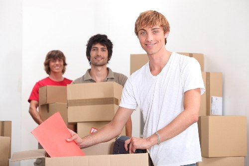 Collection team handling bulky furniture for disposal in Kingston upon Thames